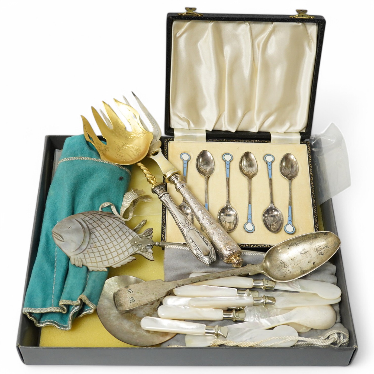 A boxed set of enamelled spoons, mother of pearl handled cutlery and similar serving spoons etc., serving spoon set 26cm long. Condition - fair to good